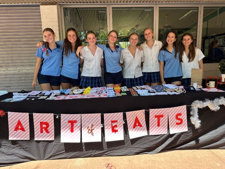 Students behind a stall